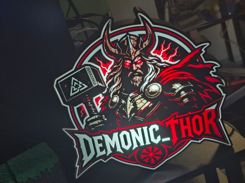 Logo of 'Demonic Thor' with a character holding a hammer on a dark background