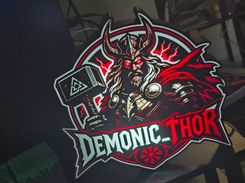 Logo of 'Demonic Thor' with a character holding a hammer on a dark background
